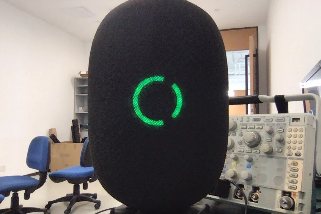Capsula prototype with green LED ring in the lab
